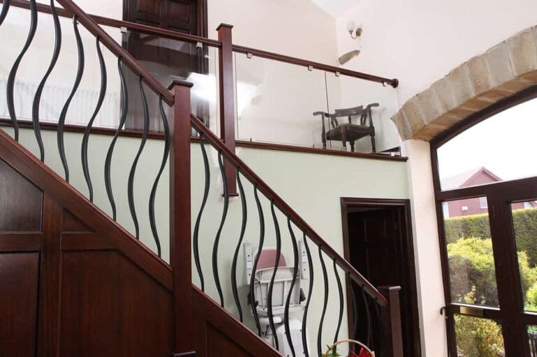 Stained sapele with wrought iron and glass