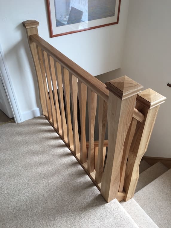 Sleek spindles with bespoke tapered newels