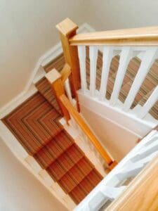 Painted spindles with stylish carpet runner