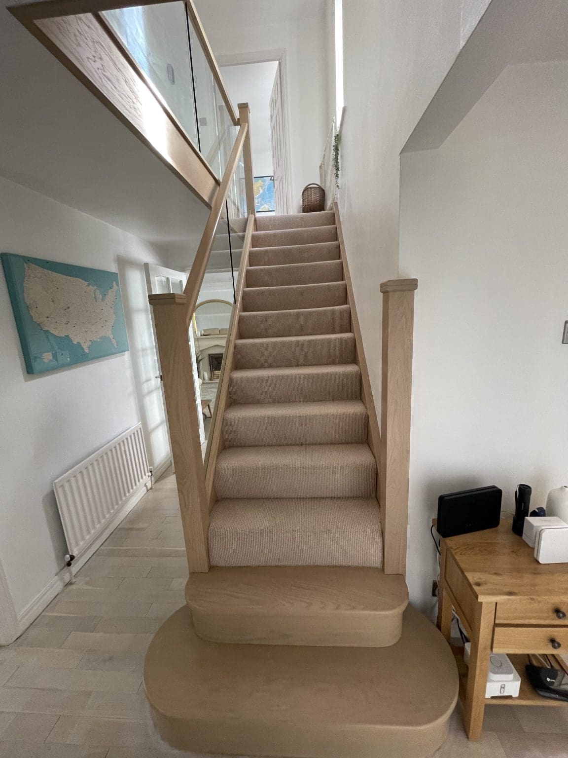A stained urban oak staircase with 10mm embedded glass installed in Gateshead, Tyne & Wear