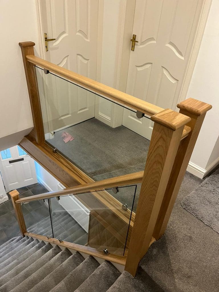 prefinished oak and clamped glass staircase renovation in Stockport