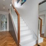 seamless glass walnut staircase East London