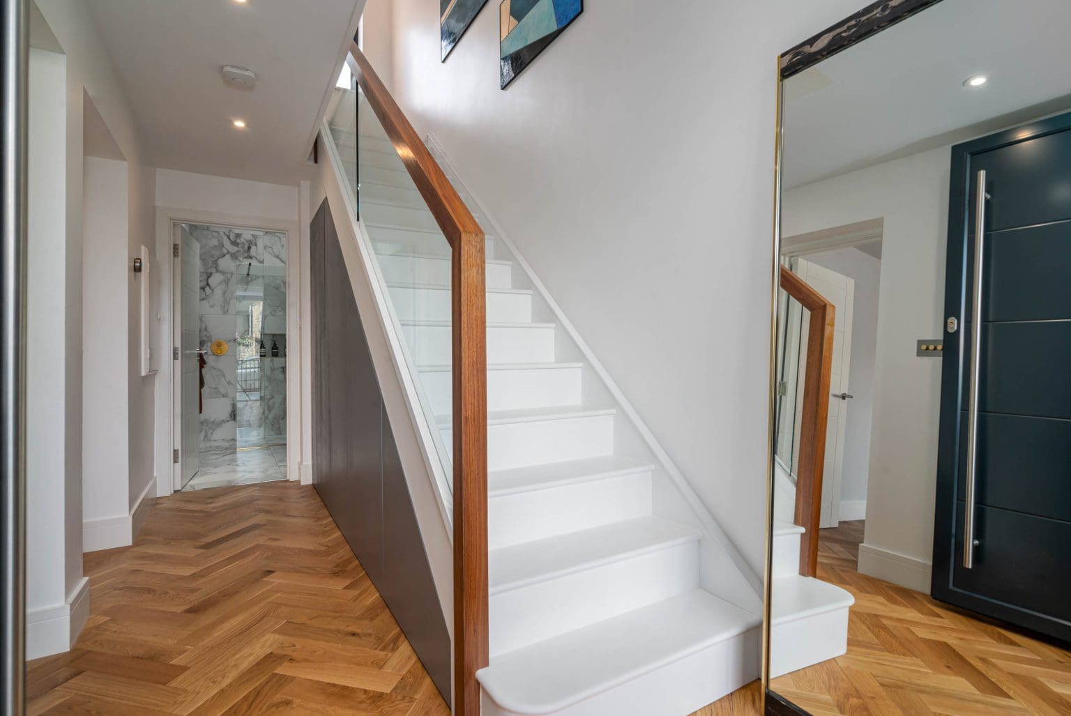 seamless glass walnut staircase East London