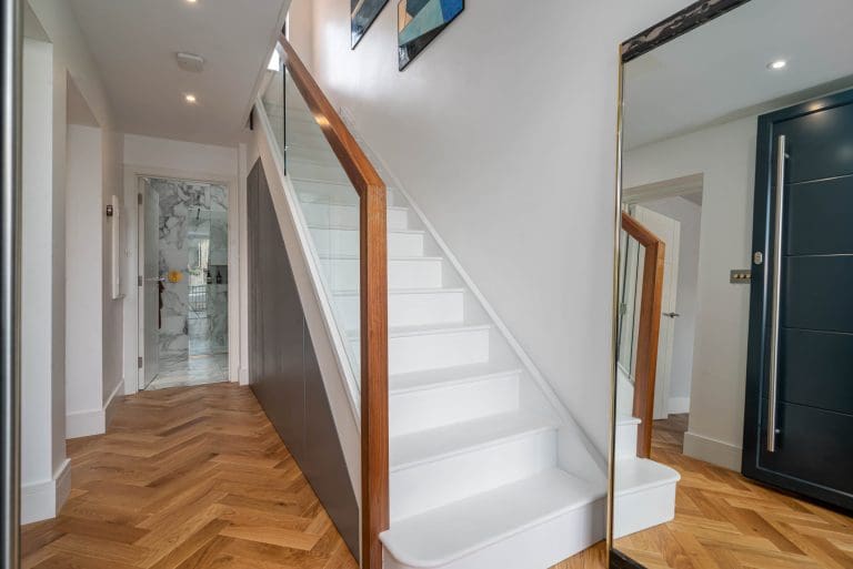 seamless glass walnut staircase East London