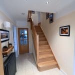An Abbott-Wade full oak staircase renovation with sleek oak spindles and oak treads & risers in Knowsley, Merseyside