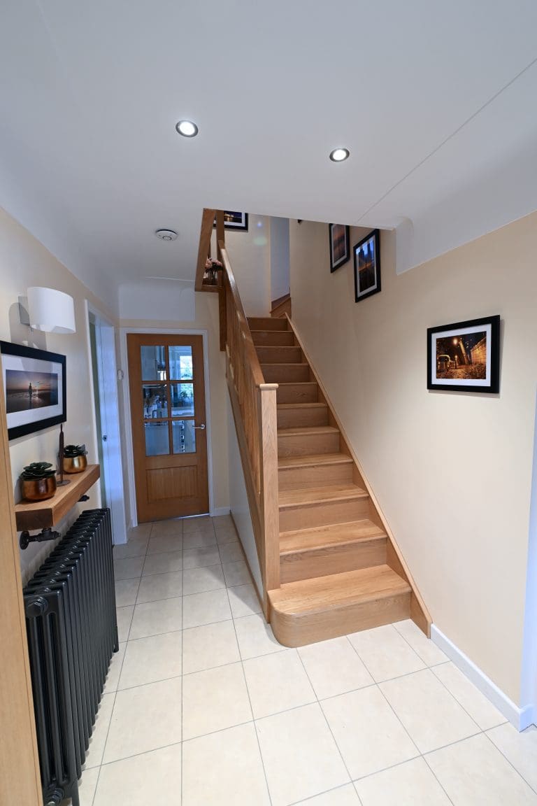 An Abbott-Wade full oak staircase renovation with sleek oak spindles and oak treads & risers in Knowsley, Merseyside