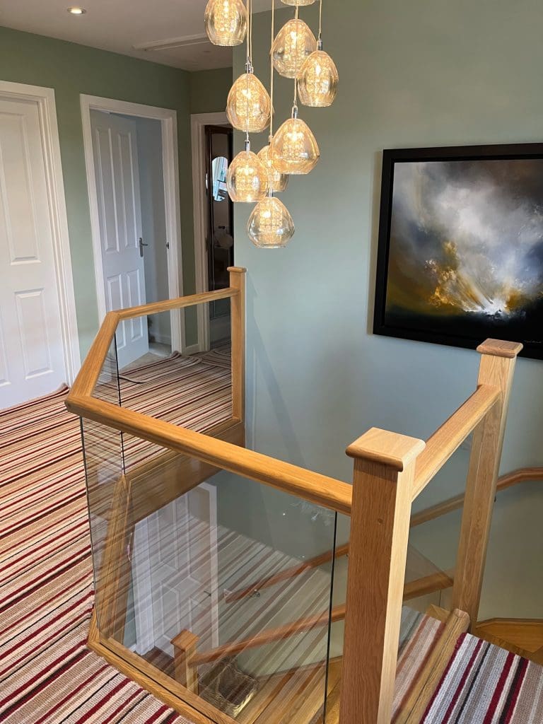 an embedded glass and oak staircase renovation in corby, northamptonshire