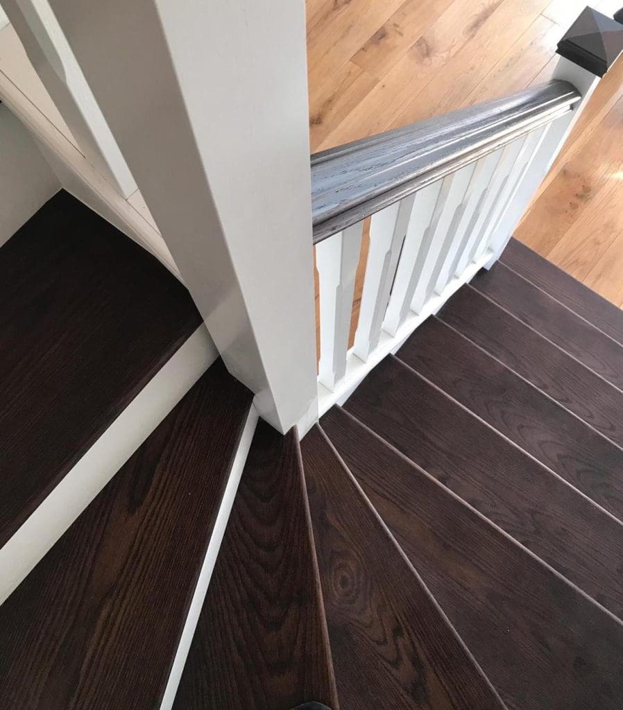 A stained oak and white staircase renovation completed by Abbott-Wade in Wetherby, Yorkshire