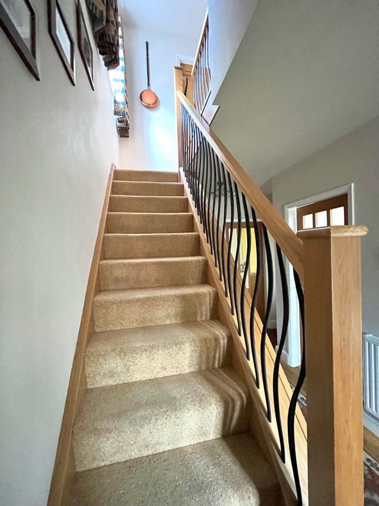 an oak staircase renovation in Kidderminster, Worcestershire with our wave metal spindles