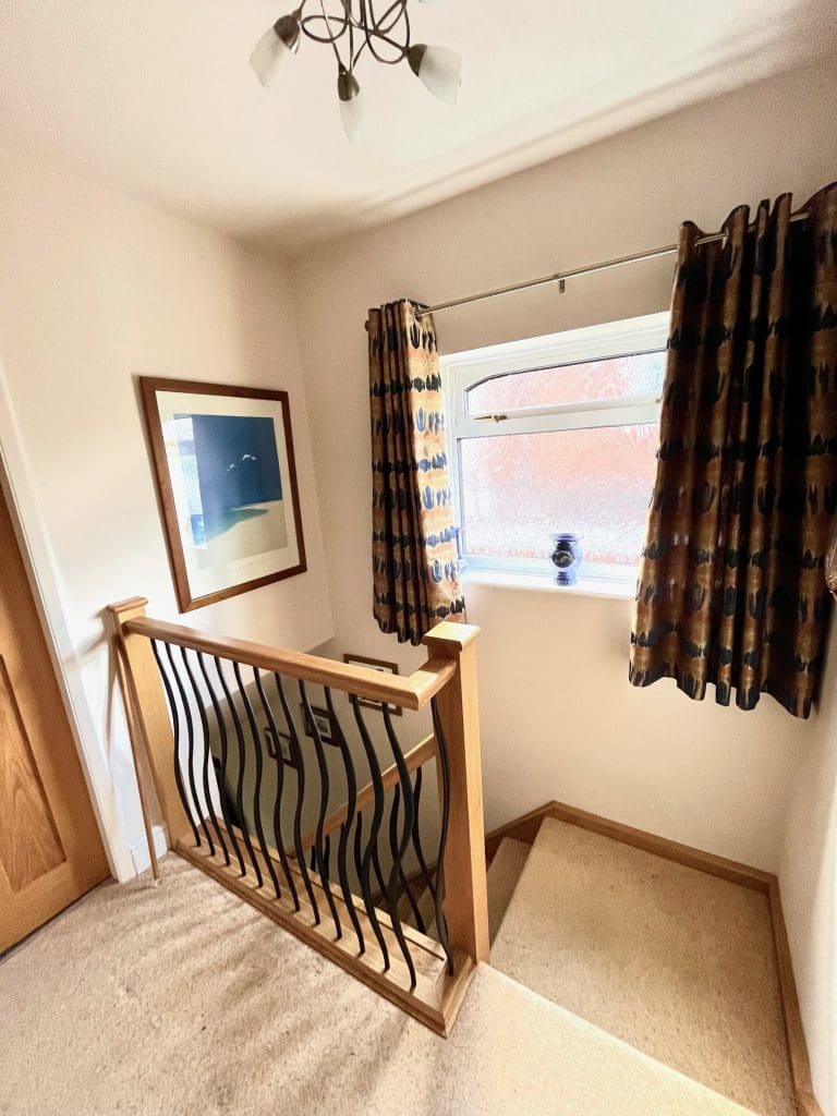 an oak staircase renovation in Kidderminster, Worcestershire with our wave metal spindles