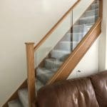 A diminishing Essex staircase renovation uses oak & 10mm embedded glass to transform this living area in Billericay.