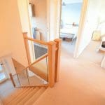A Welsh open-tread staircase in Caerphilly is renovated using prefinished natural oak & glass.