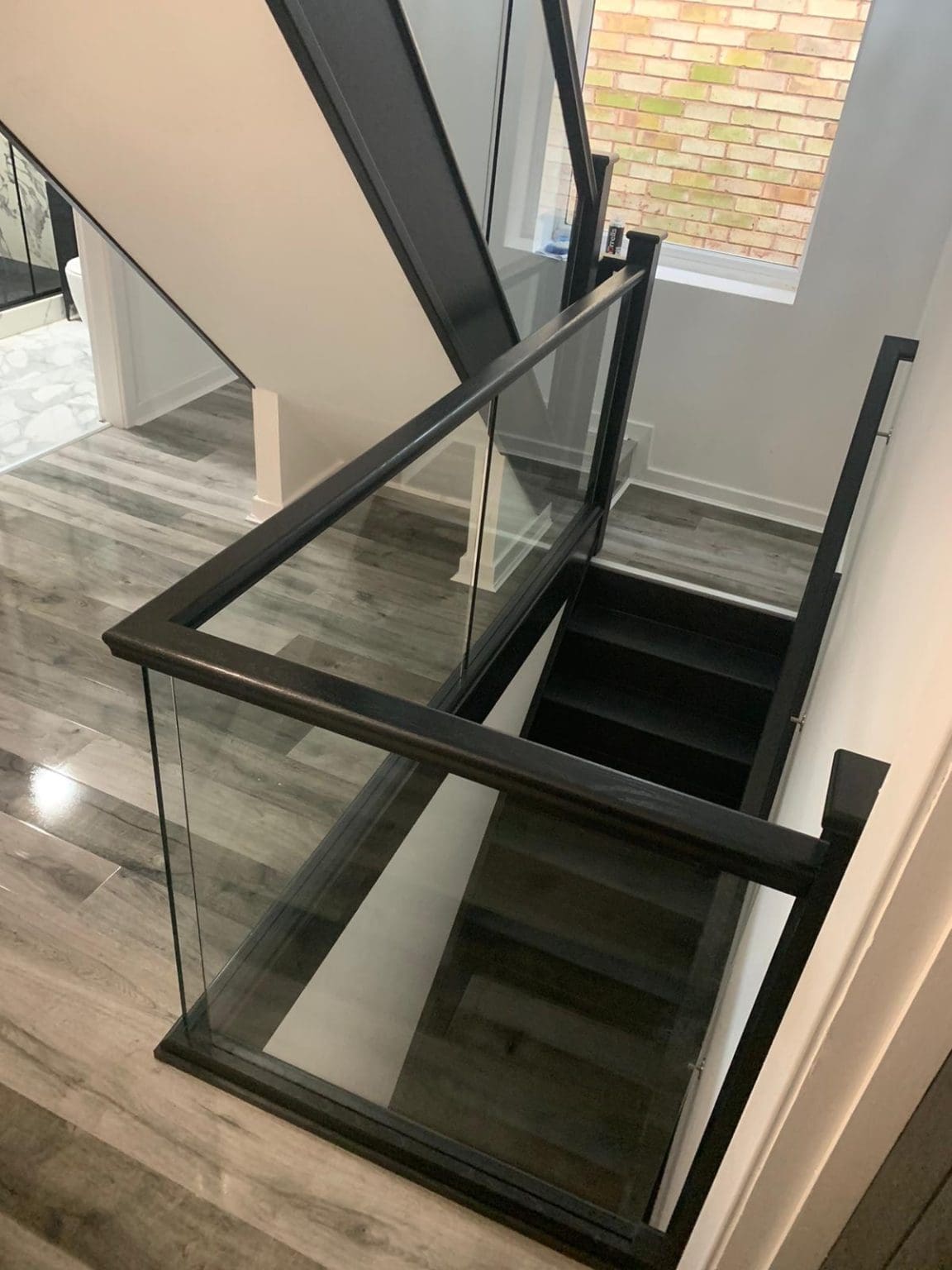 A super-modern & super-stylish black staircase makes a brave & bold statement in this West Midlands dream home.
