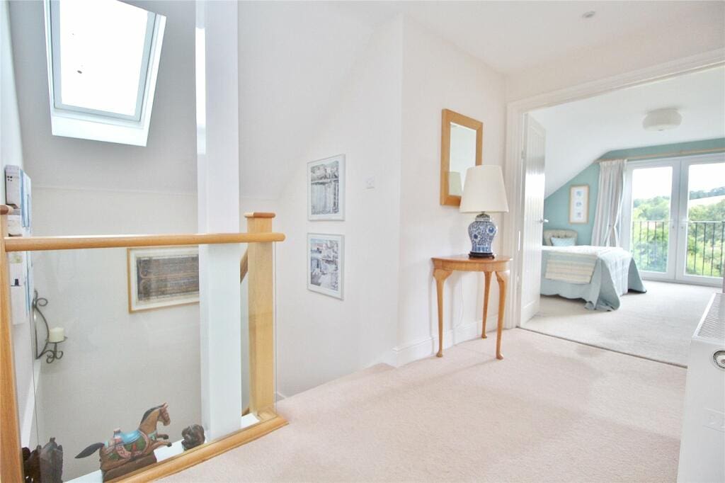 This stairway in Worthing is now light, bright and eye catching thanks to an oak & glass staircase renovation.