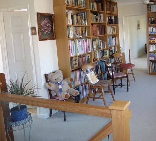 An oak & glass staircase renovation in Yeovil opens up this Somerset home office & library area.
