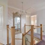 This winding clamped glass in Hindley has the added flourish of a double curtail feature step.