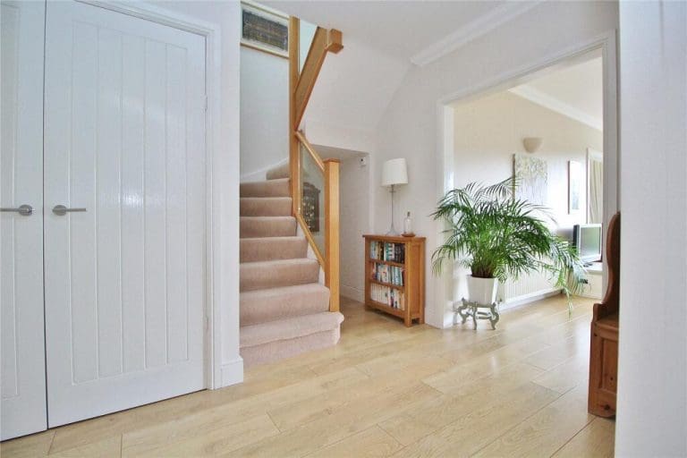 This stairway in Worthing is now light, bright and eye catching thanks to an oak & glass staircase renovation.