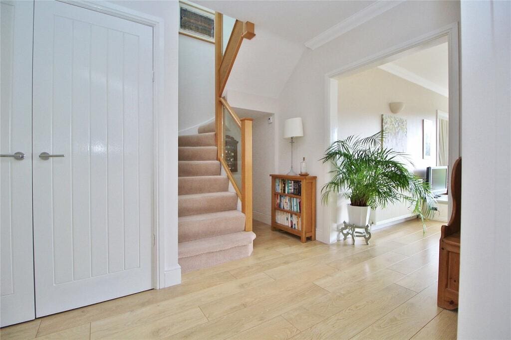 This stairway in Worthing is now light, bright and eye catching thanks to an oak & glass staircase renovation.