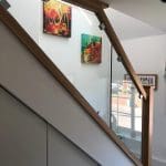 A diminishing glass staircase renovation in Wokingham including an oversized glass partition