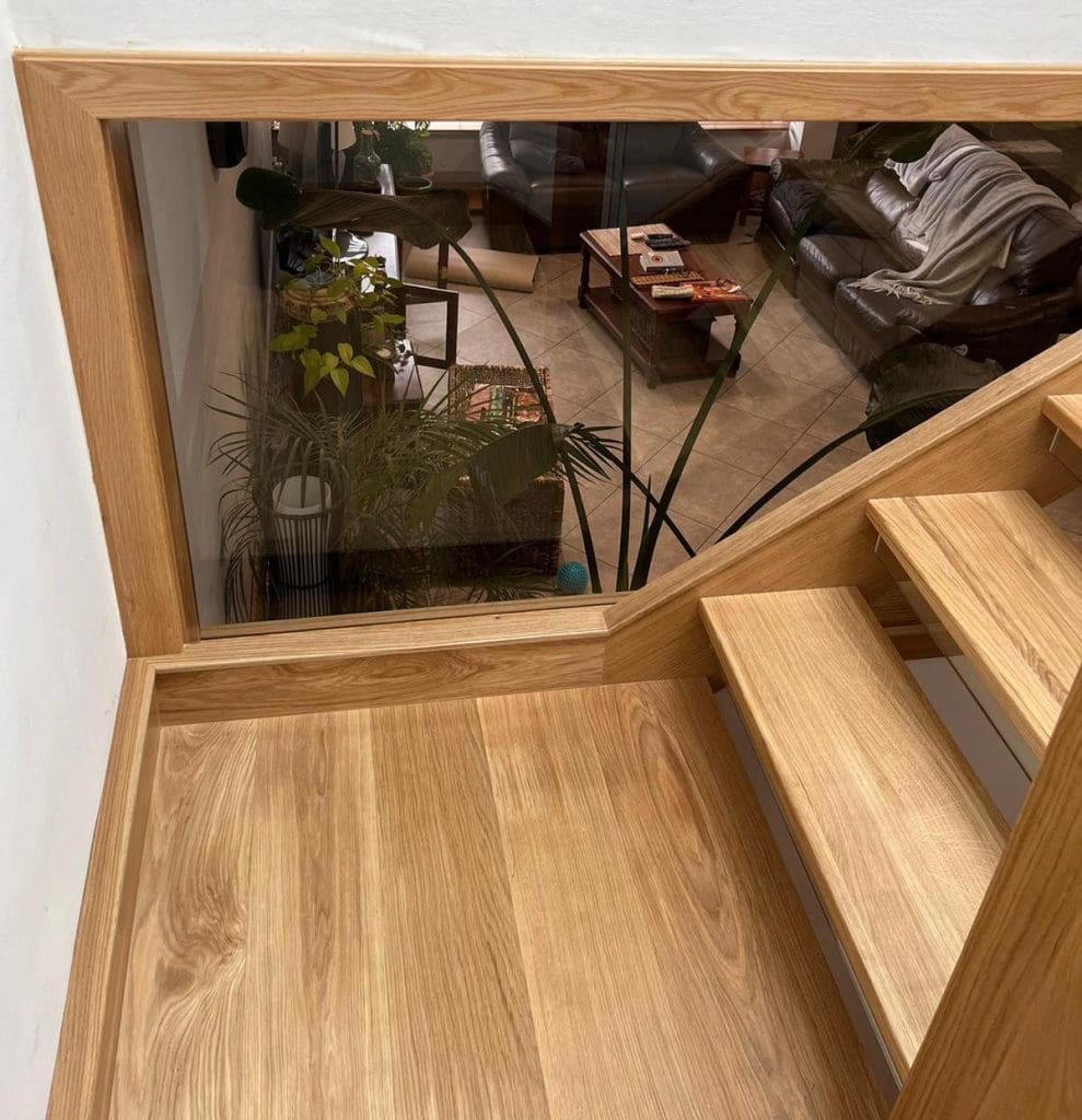 A striking open tread oak staircase in Cheadle Hulme which looks magnificent from every vantage point.