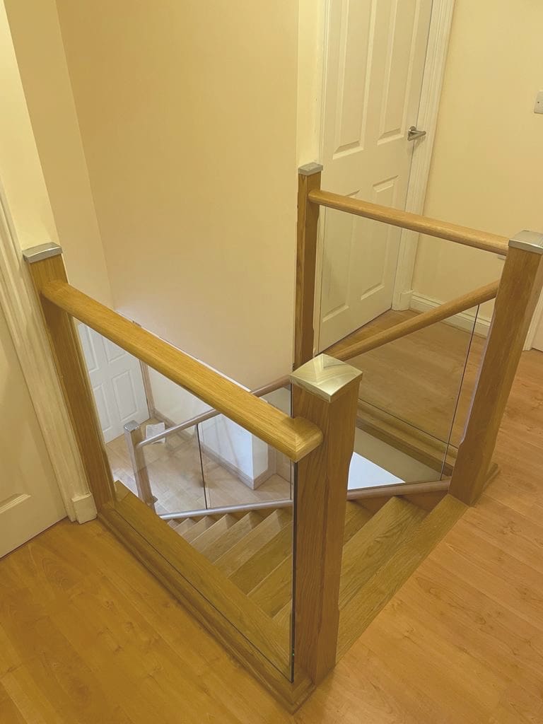 A Penrith home transformed with an oak & glass staircase renovation with fully clad treads & risers