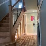 Stunning full height glass panels separate the upper & lower staircases to create a dramatic, eye-catching Stevenage staircase & hallway.
