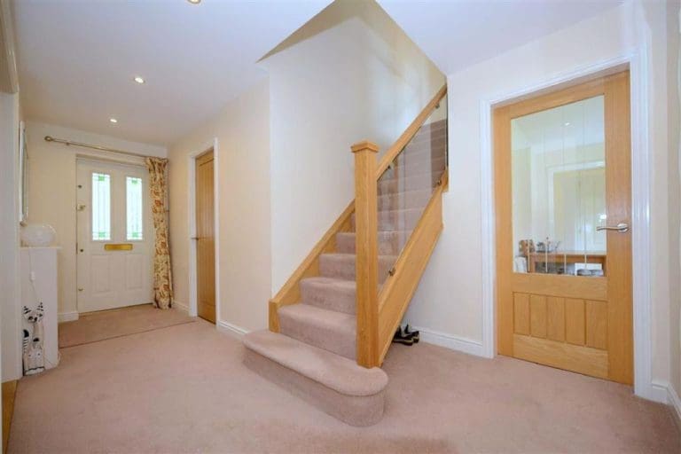 A warm & bright glass and oak staircase refurbishment transforms this homely Shropshire staircase in Telford.