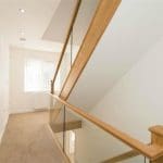 3 storeys of this bright, modern home in Burnley are united cohesively thanks to this new oak & glass Abbott-Wade embedded glass & oak staircase.