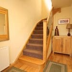 A perfect staircase for its surroundings, this oak & glass refurbishment adds to the warm & cosy feel of this Rossendale home