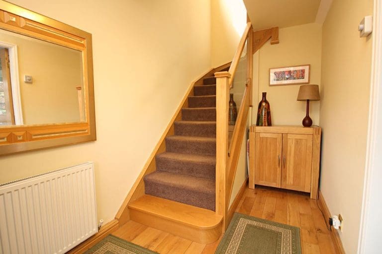 A perfect staircase for its surroundings, this oak & glass refurbishment adds to the warm & cosy feel of this Rossendale home