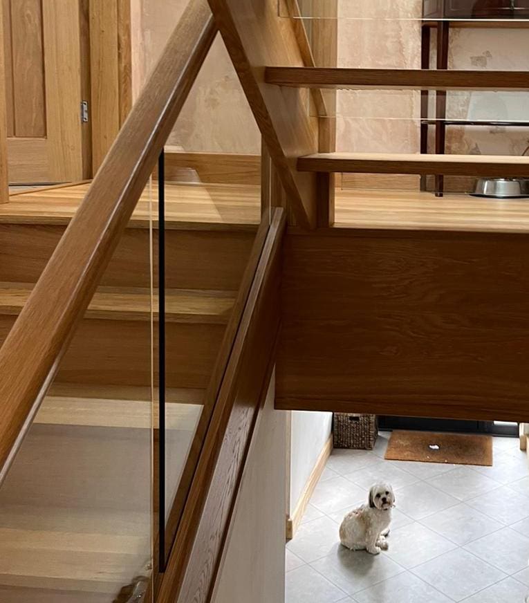 A striking open tread oak staircase in Cheadle Hulme which looks magnificent from every vantage point.