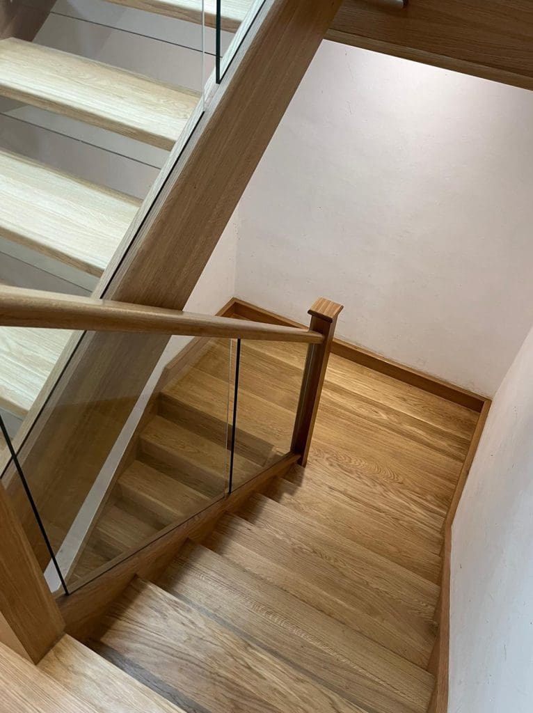 A striking open tread oak staircase in Cheadle Hulme which looks magnificent from every vantage point.