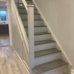 A modern 2-tone oak and glass painted staircase refurbishment installed in Leatherhead.