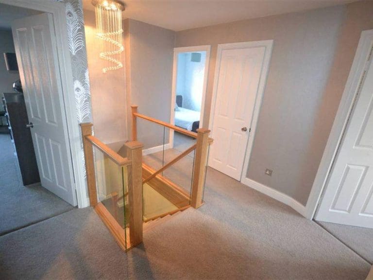 A modern Warrington home transformed with prefinished natural oak & embedded glass in Great Sankey.