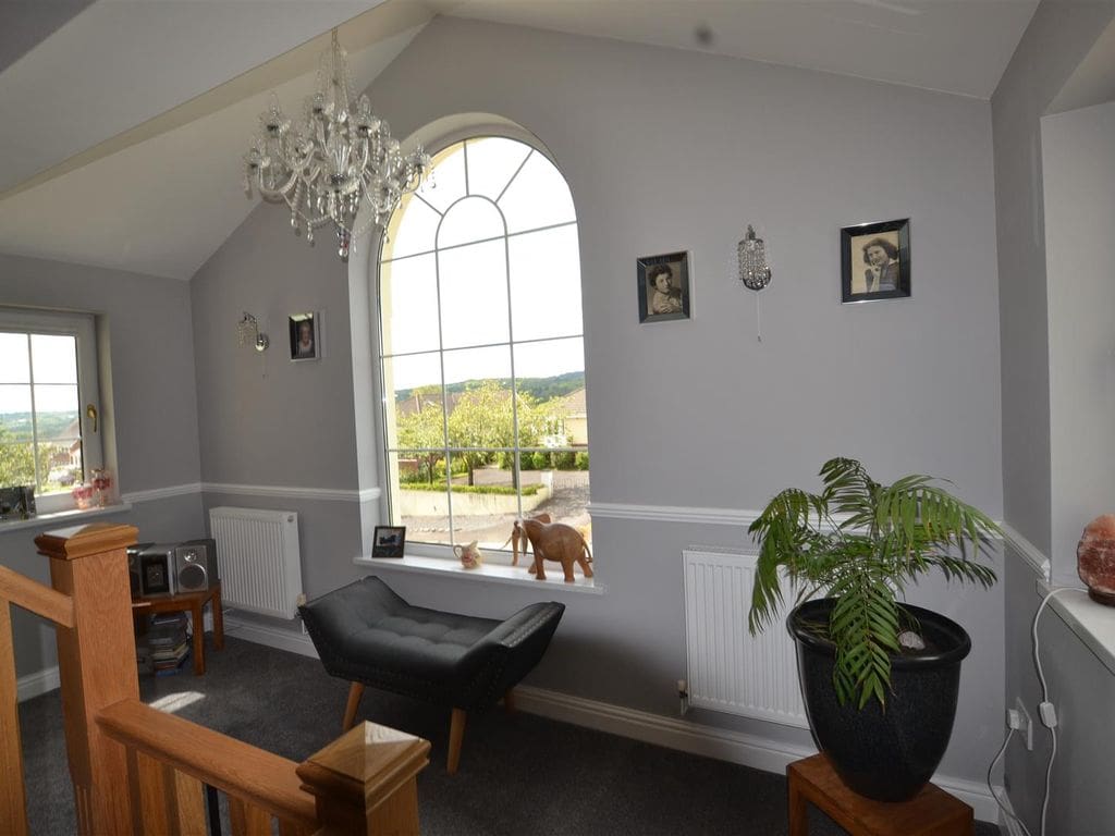 A 3 storey home overlooking Carmarthen Bay transformed with a grand oak & forged steel staircase renovation.