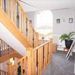 A 3 storey home overlooking Carmarthen Bay transformed with a grand oak & forged steel staircase renovation.