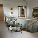A grand branching feature staircase with oak & embedded glass in Brackley transforms this Northamptonshire home.