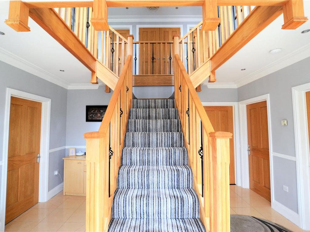 A 3 storey home overlooking Carmarthen Bay transformed with a grand oak & forged steel staircase renovation.
