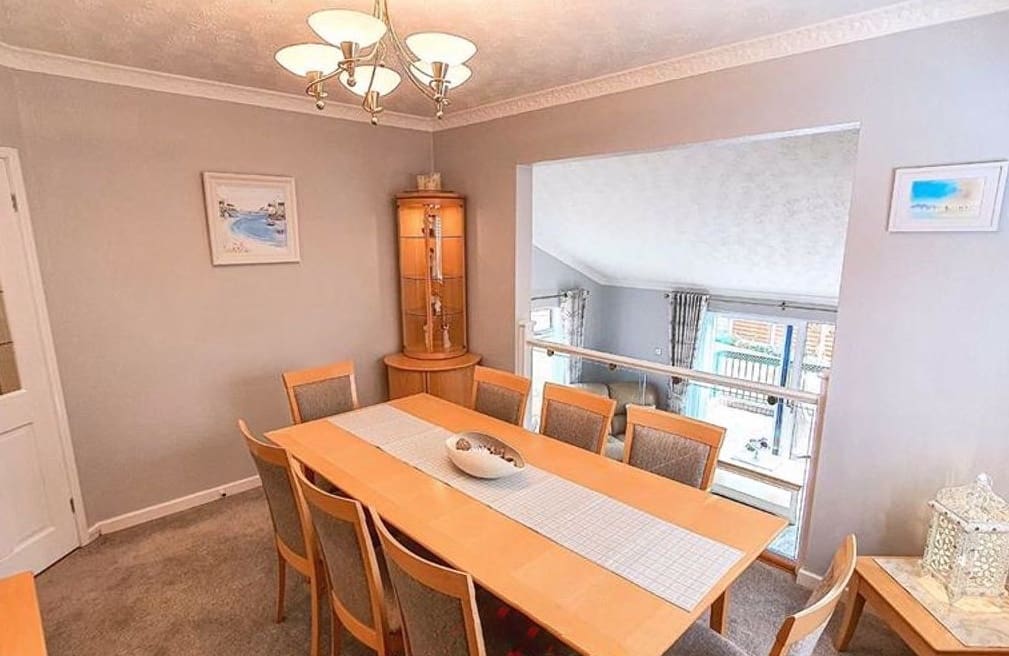 A split-level living home united thanks to an oak & glass balustrade in Flint, Flintshire.