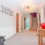 Light floods this Horsforth home's hallyway thanks to our 10mm clamped glass balustrade.