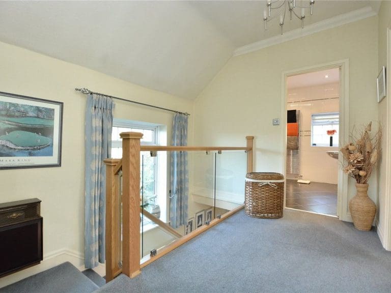 Clamped 10mm glass and warm natural oak breathes new life into this Leeds home.