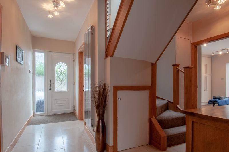 A winding prefinished natural oak & glass staircase renovation in Rushden.
