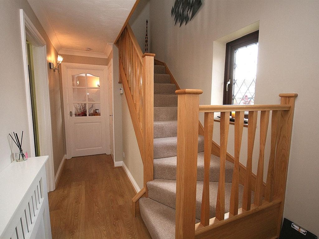 Abbott-Wade's Sleek Twist oak spindles adorn this balustrade to stylishly transform this staircase in Leighton Buzzard, Interior Door,