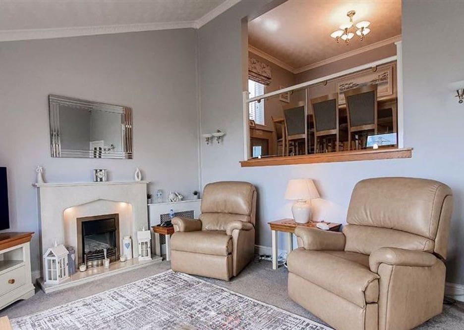 A split-level living home united thanks to an oak & glass balustrade in Flint, Flintshire.