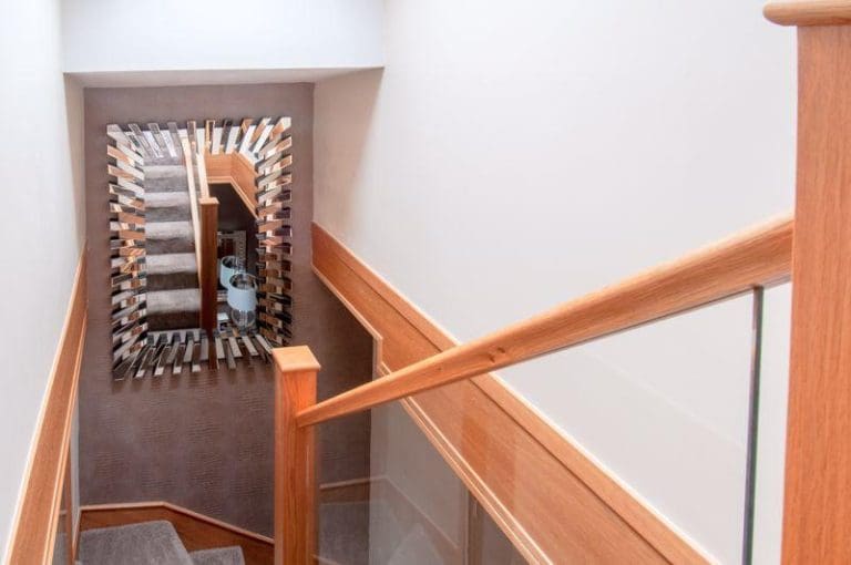 A winding prefinished natural oak & glass staircase renovation in Rushden.