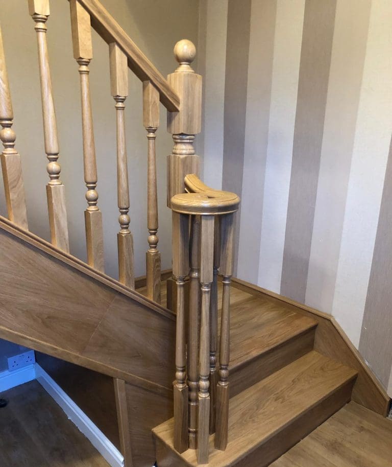 A traditional turned oak staircase renovation with stylish volute in Buckley.