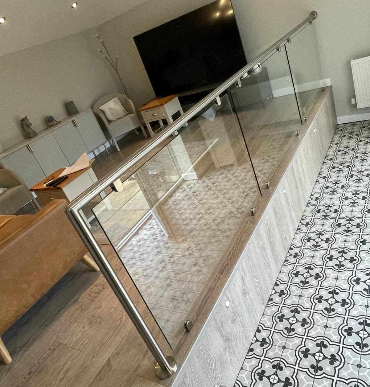 split level living room with stainless steel & glass